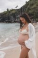 Photo of Michelle, of Mindful with Michelle, pregnant on the beach